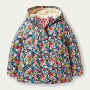 Mini Boden girls' sherpa-lined anorak coat with a blue floral print